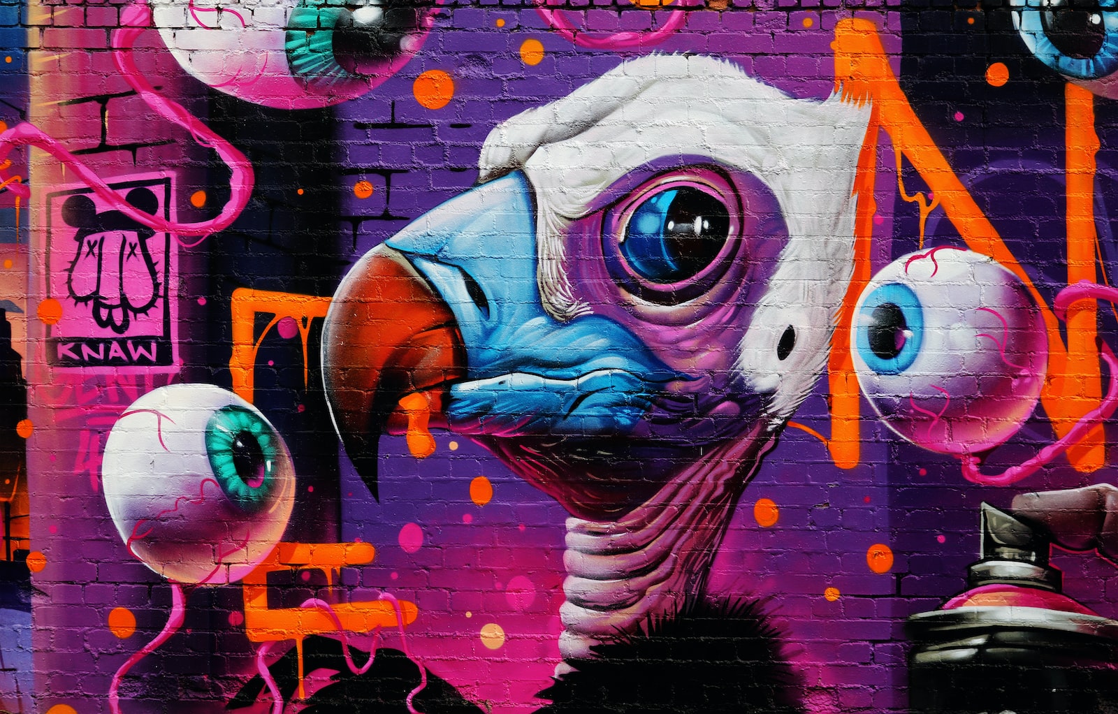 purple and white bird graffiti